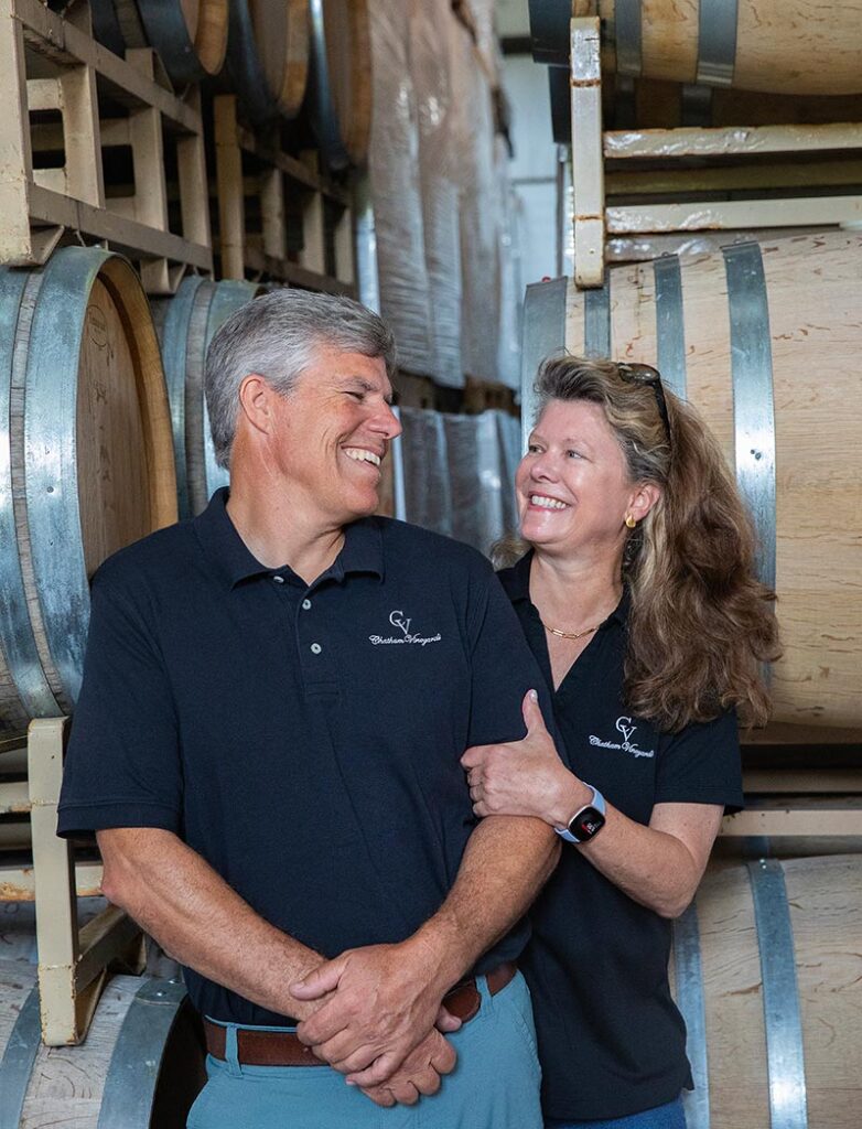 Chatham Vineyards owners smiling in the cellar