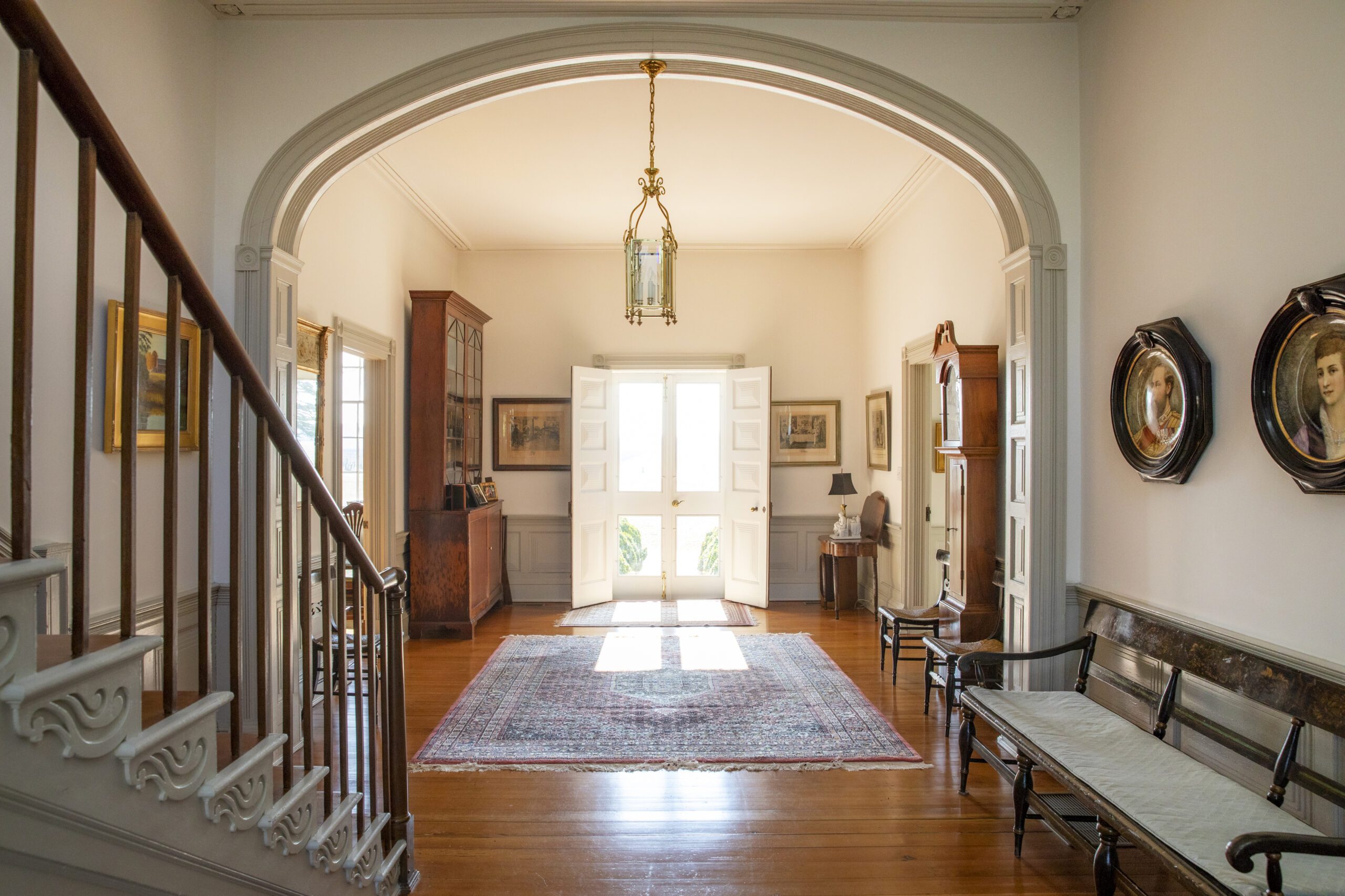 Interior of entrance to Chatham Vineyards, including the front door and staircase